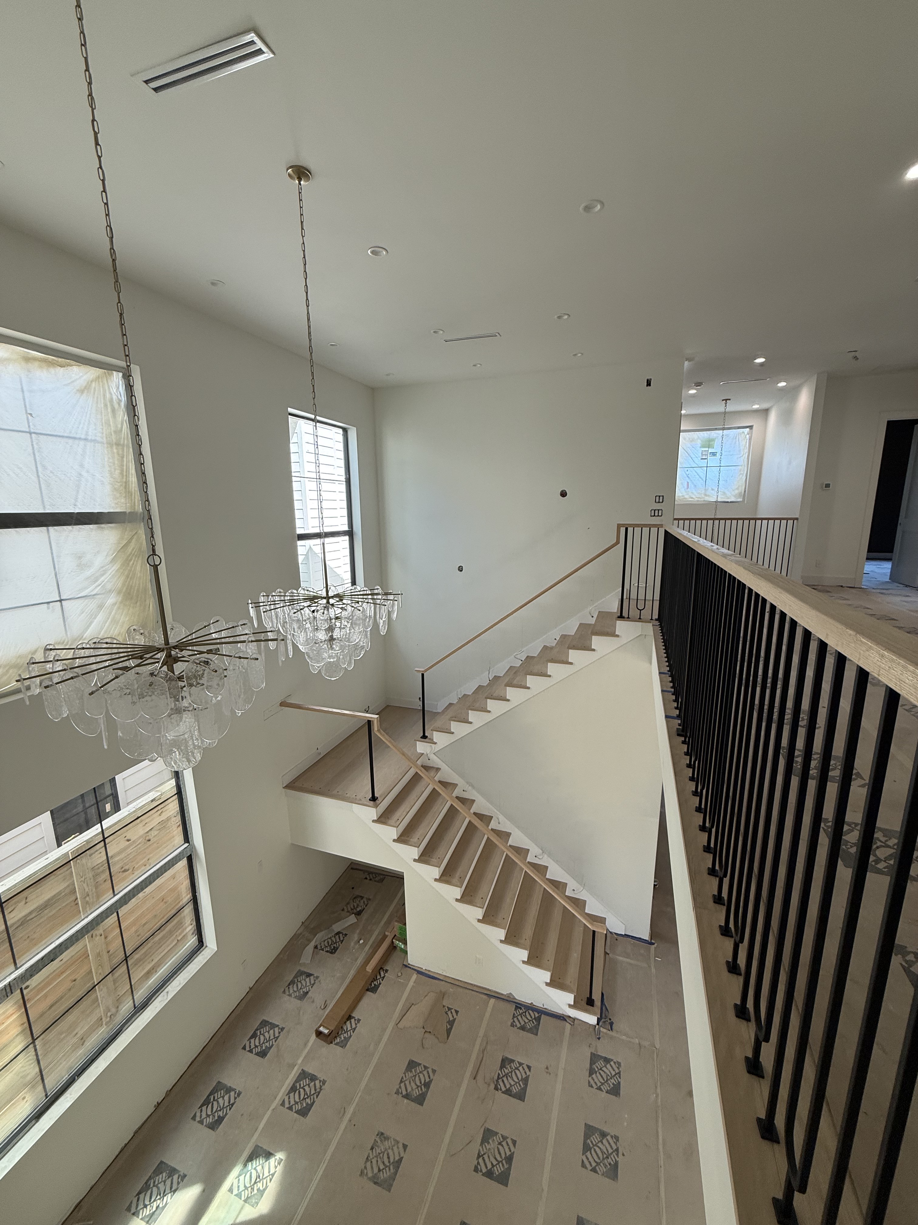 Custom oak staircase with black iron railing